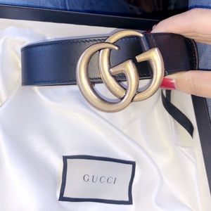 Black and gold Gucci belt